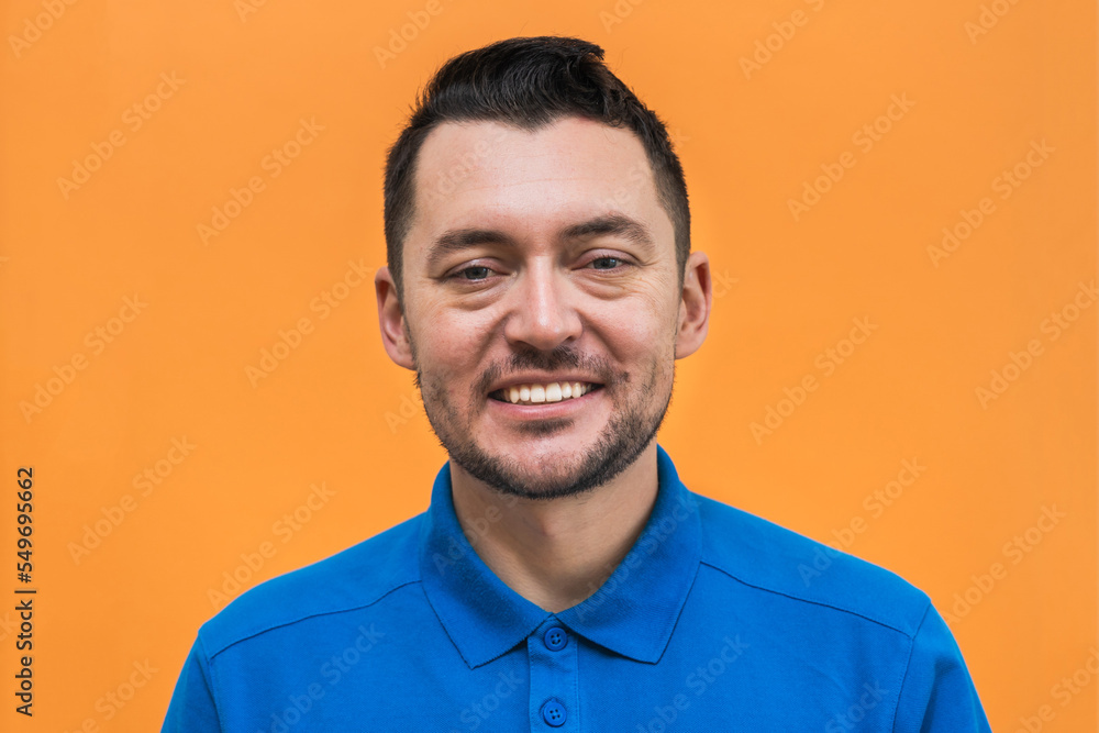 Portrait of the man on orange background. Man's emotions Portrait of the man on orange background. Man's emotions
