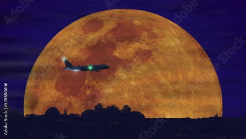 Airplane in front of moon light at night (4K).
Animation of plane with huge moon rising as background at night. 
Full 4K animation and composit.