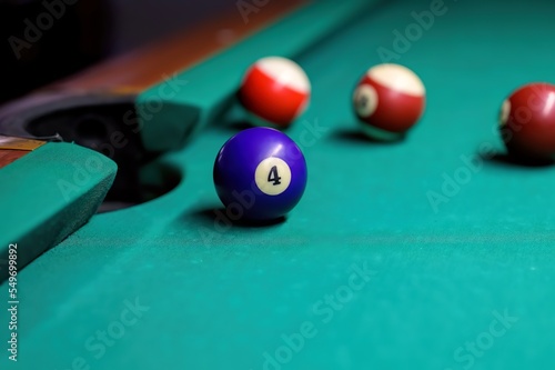 Billiard balls on the green table. billiard balls in front of the pocket.