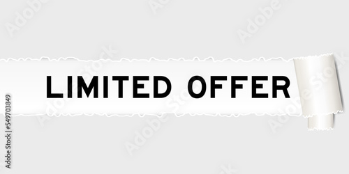 Ripped gray paper background that have word limited offer under torn part