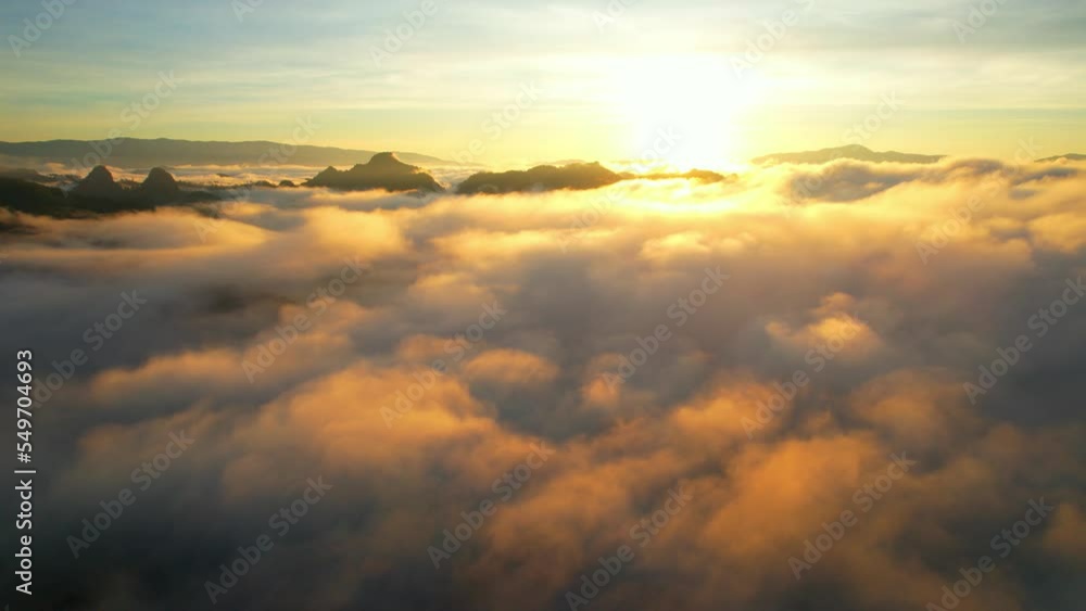 Drone flying over heavy dense fog during sunrise, Mountain scenery and sky in the background. amazing scenery in golden hour. Mae Hong Son Province, Northern Thailand. nature and travel concept. 4K
Drone flying over heavy dense fog during sunrise, Mountain scenery and sky in the background. amazing scenery in golden hour. Mae Hong Son Province, Northern Thailand. nature and travel concept. 4K