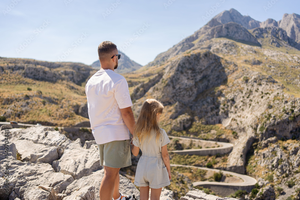 Family father and daughter hiking in mountains travel vacations outdoor adventure hobby healthy lifestyle trip eco tourism dad and child enjoying landscape view