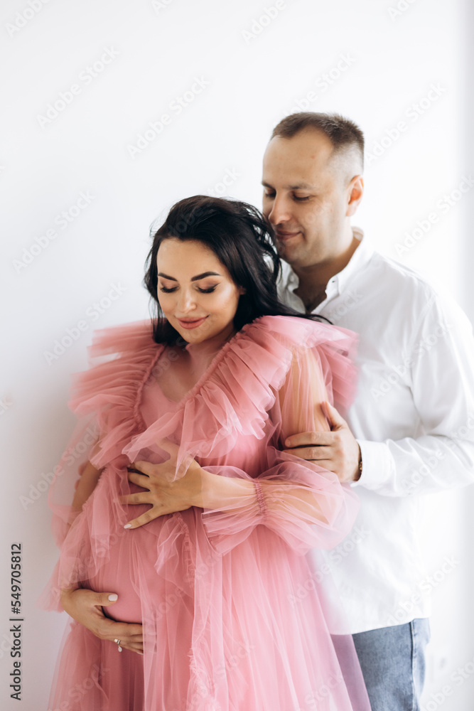 Happy family expecting a baby, concept of support and care Happy family expecting a baby, concept of support and care
