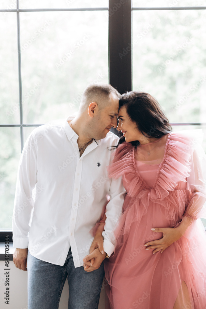 Happy family expecting a baby, concept of support and care Happy family expecting a baby, concept of support and care