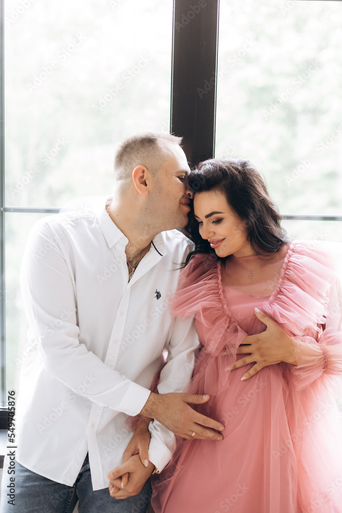 Happy family expecting a baby, concept of support and care Happy family expecting a baby, concept of support and care