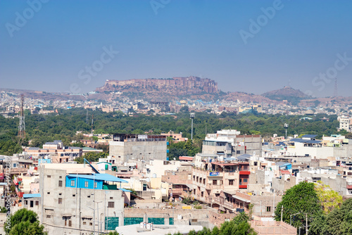 city view with ancient fort in the background and blue sky at morning © explorewithinfo
