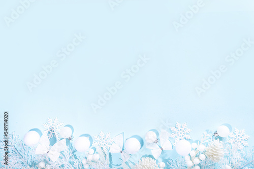 White and blue Christmas background, White Christmas concept. Merry Xmas, New Year Happy Holidays greeting card, frame, banner. Noel. Festive white branches, decor, ornaments, blue background top view