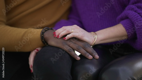 Girlfriend hand caressing boyfriend. Interracial diverse couple  close-up hands