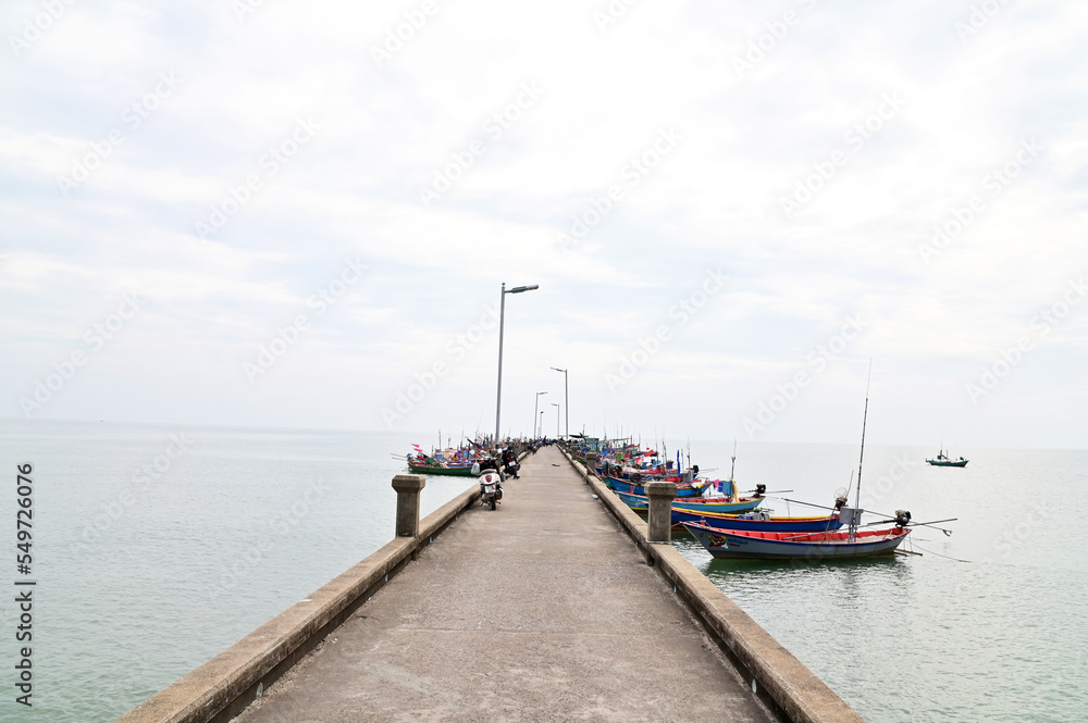 CHANTABURI, THAILAND - November 20, 2022 : Many Fishing Boats docked at the pier to take the fish out of the boat waiting for someone to buy.