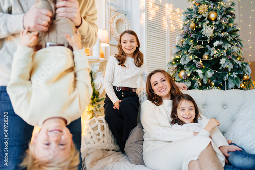 dad plays with his son and holds him upside down. father-child games. 