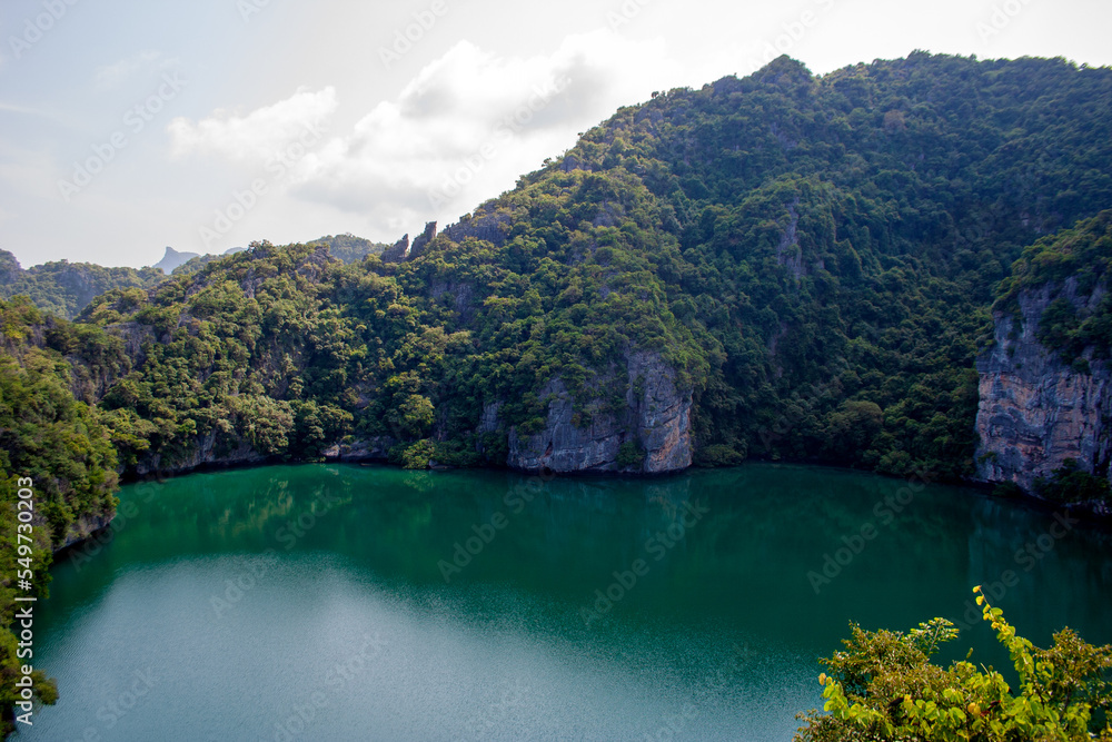 Beautiful lake of Ko Mae Ko island with tropical plants on rocky cliffs Beautiful lake of Ko Mae Ko island with tropical plants on rocky cliffs