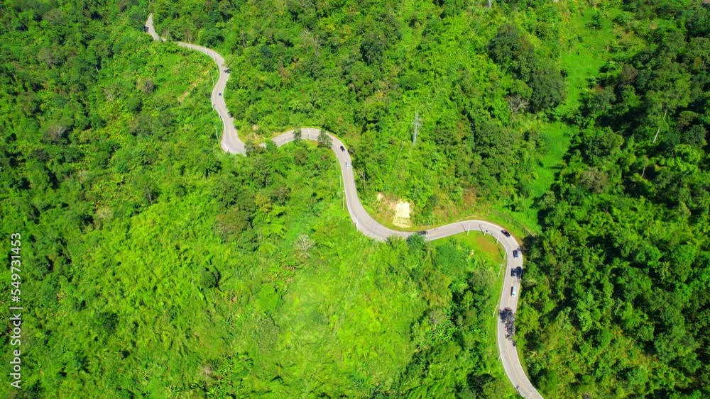 Top view above cars driving on winding road in green tropical rainforest. countryside landscape. Thailand, Southeast Asia. Aerial view from a drone. transportation concept. natural background
Top view above cars driving on winding road in green tropical rainforest. countryside landscape. Thailand, Southeast Asia. Aerial view from a drone. transportation concept. natural background