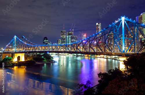 The  Storey Bridge  spanning the River Brisbane with cityscape illuminated at night 