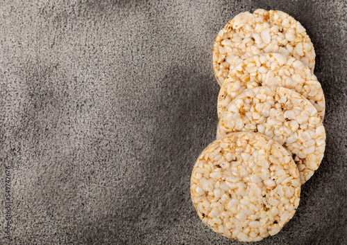 Rice cakes on a black table. Bread. Airy rice bread. dietary crispy round rice cakes. Place for text. Place to copy. Healthy food. dietary product.