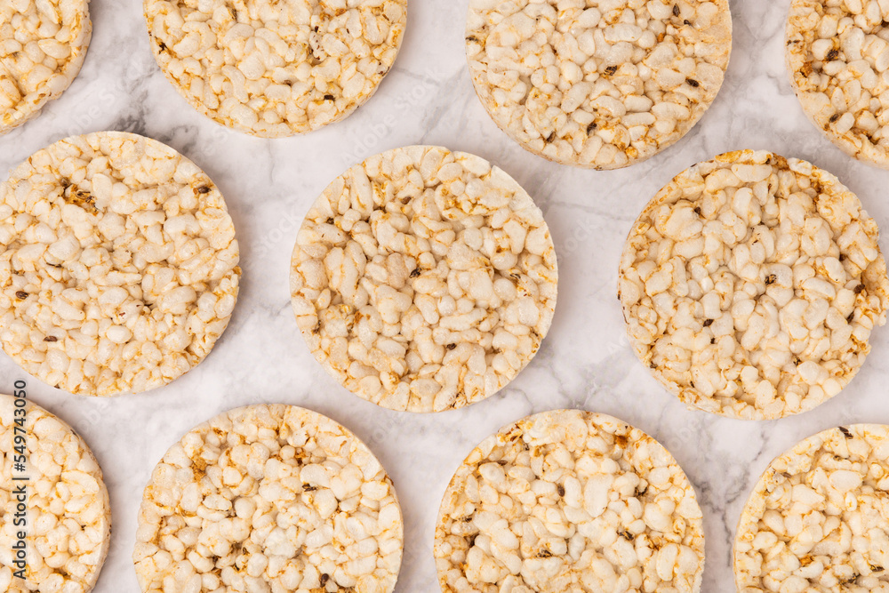 Rice bread on a marble background. Rice cakes. Diet bread on the table.Healthy food without yeast.Place for text. Place to copy. Healthy food. dietary product. Rice bread on a marble background. Rice cakes. Diet bread on the table.Healthy food without yeast.Place for text. Place to copy. Healthy food. dietary product.