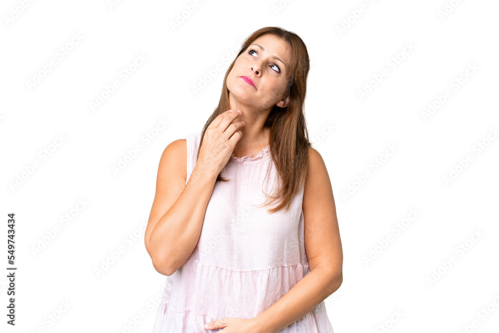 Middle age woman over isolated background looking up while smiling Middle age woman over isolated background looking up while smiling
