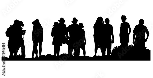 Silhouette of a group of friends on vacation on the edge of the hill.