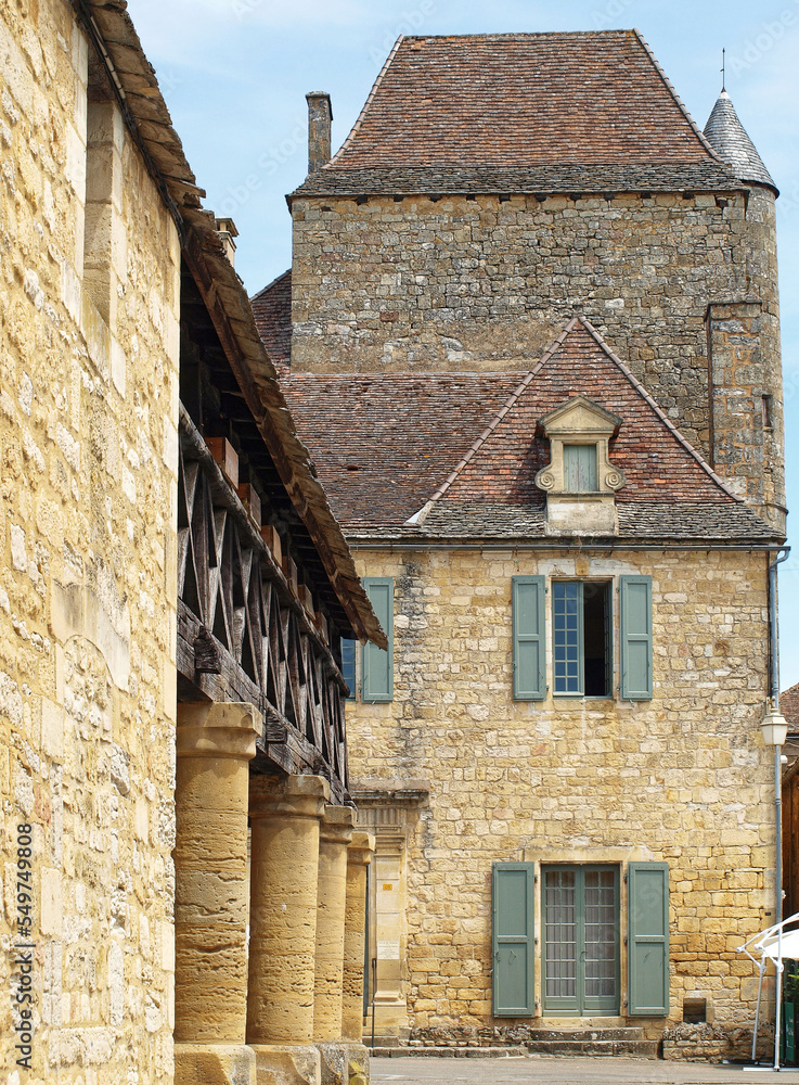 Royal Bastide of Domme and medieval town of Périgord Noir. Traditional half-timbered House in Hall Square. Entrance to visit the caves