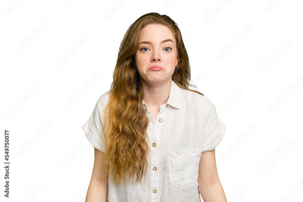 Young caucasian redhead woman isolated shrugs shoulders and open eyes confused. Young caucasian redhead woman isolated shrugs shoulders and open eyes confused.