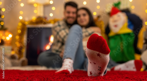 christmas couple at fireplace
