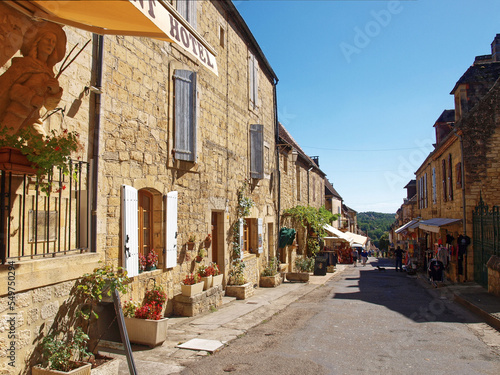 Majestic Bastide of Domme, medieval town of Périgord Noir - Shopping and quiet narrow street with traditional perigordian yellow stone houses, most medieval architecture photo