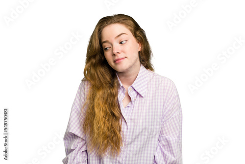 Young caucasian redhead woman isolated laughs and closes eyes, feels relaxed and happy. © Asier