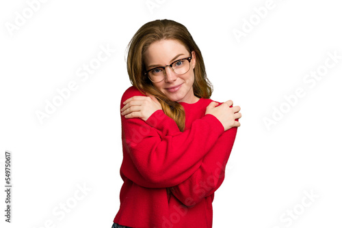 Young caucasian redhead woman isolated hugs, smiling carefree and happy.