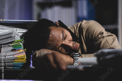 Business people in the night office who work overtime are sleepy and tired from overwork.