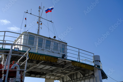Captain cabin on ferry with Russian flag.