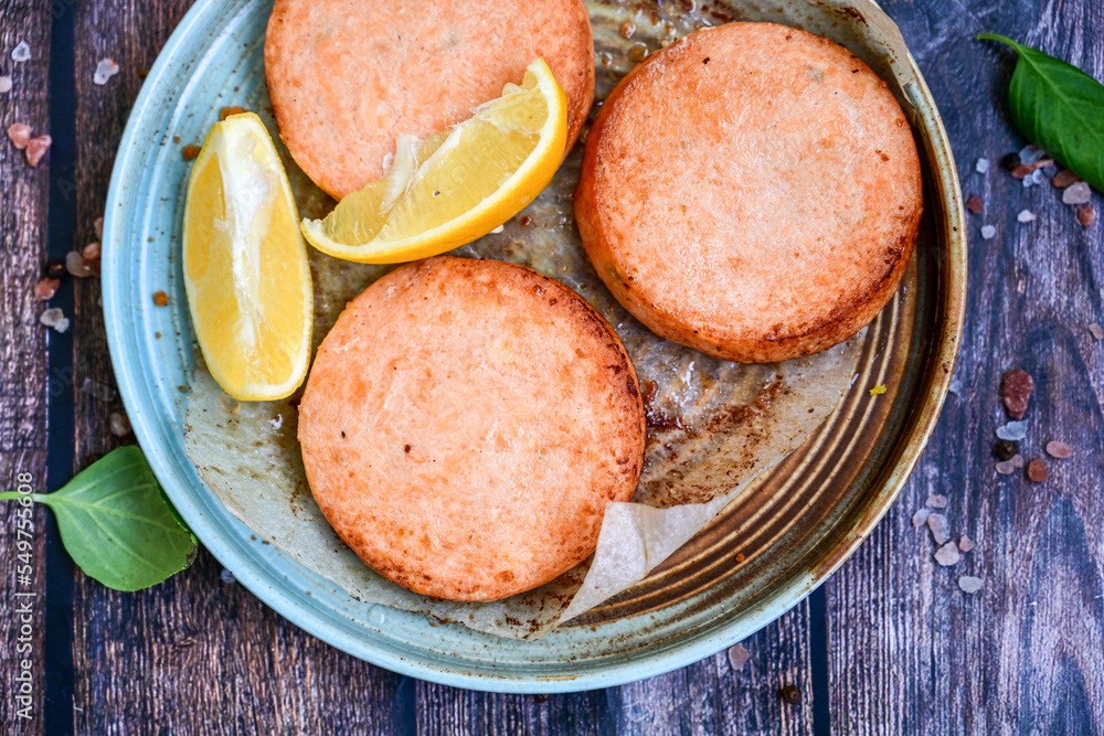 Homemade ketogenic Salmon Burger with Tartar Sauce and whole grain ketgenic bread. Healty diet food Homemade ketogenic Salmon Burger with Tartar Sauce and whole grain ketgenic bread. Healty diet food
