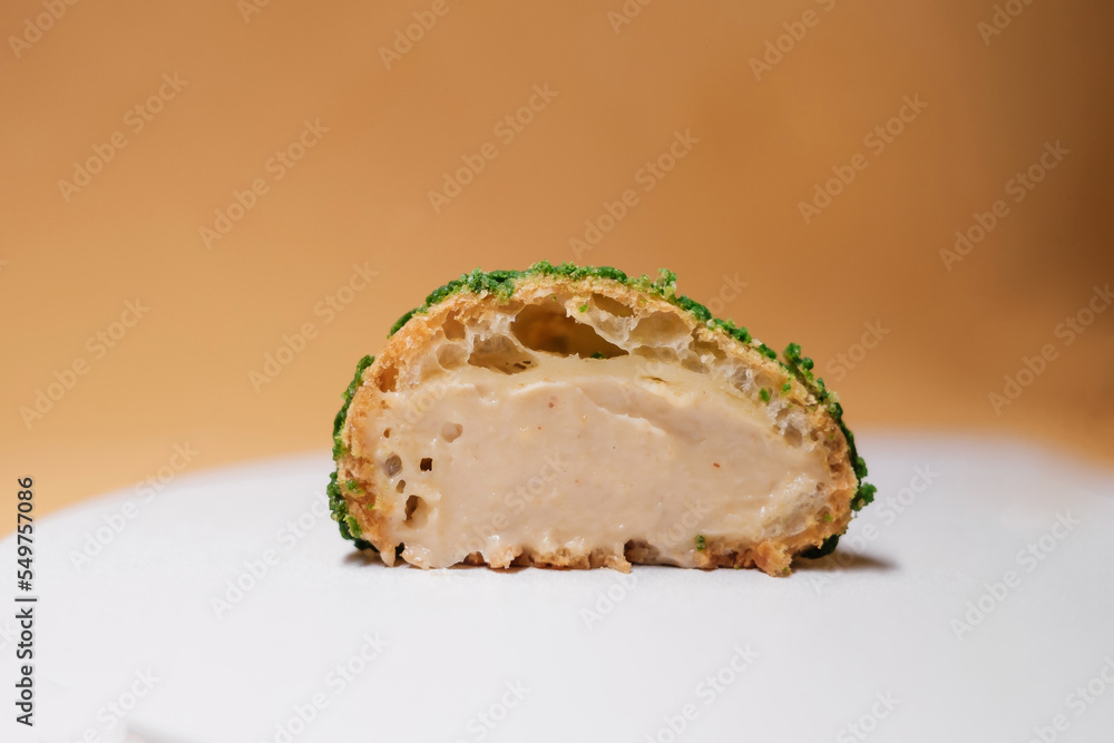 cut cakes with chocolate and cream filling on yellow background cut cakes with chocolate and cream filling on yellow background