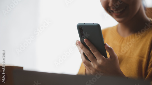 Online store salesperson is writing a customer's shipping address on parcel box before sending it to private carrier for delivery to customer. The idea of opening an online store and packing products.