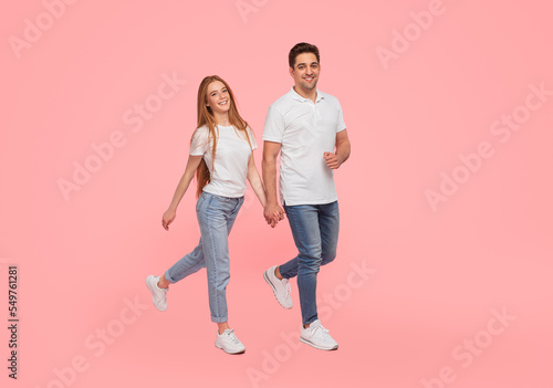 Happy friendly couple holding hands
