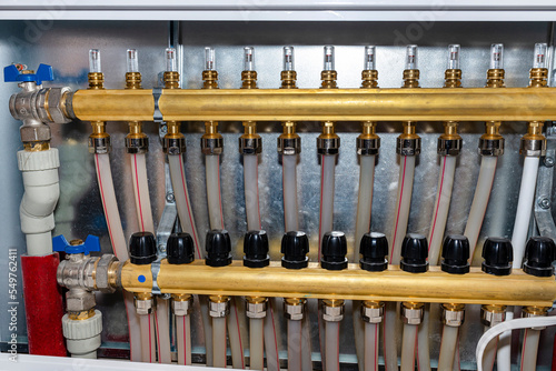New brass manifold for underfloor heating systems with magnetic rotameters, serving 12 circuits.