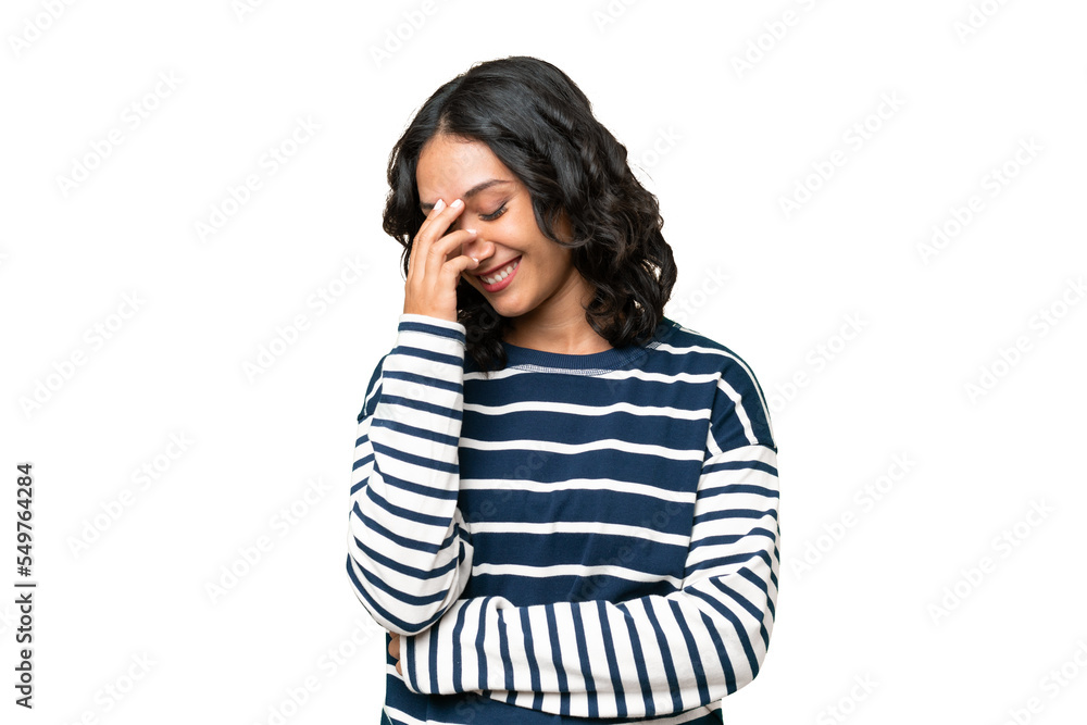 Young Argentinian woman over isolated background laughing Young Argentinian woman over isolated background laughing