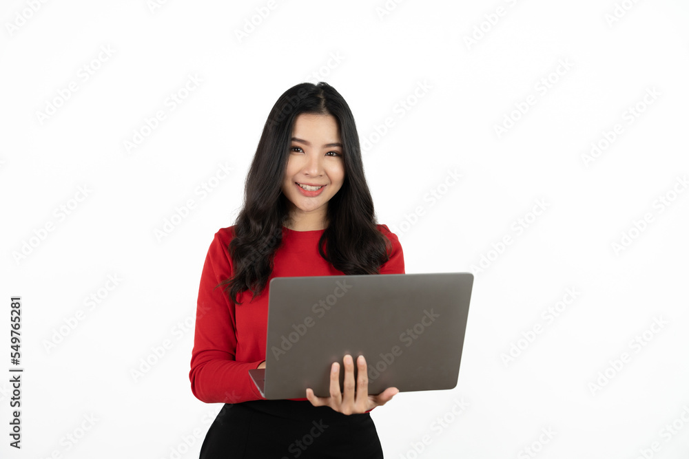 Happy asian business woman holding laptop computer and looking at the camera over white background. Happy asian business woman holding laptop computer and looking at the camera over white background.