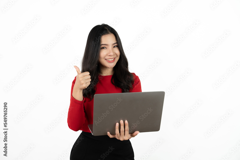 Happy asian business woman holding laptop computer and looking at the camera over white background. Happy asian business woman holding laptop computer and looking at the camera over white background.