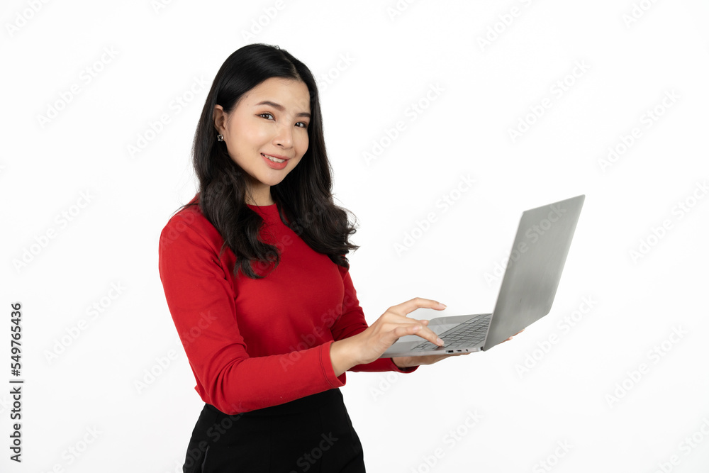 Happy asian business woman holding laptop computer and looking at the camera over white background. Happy asian business woman holding laptop computer and looking at the camera over white background.