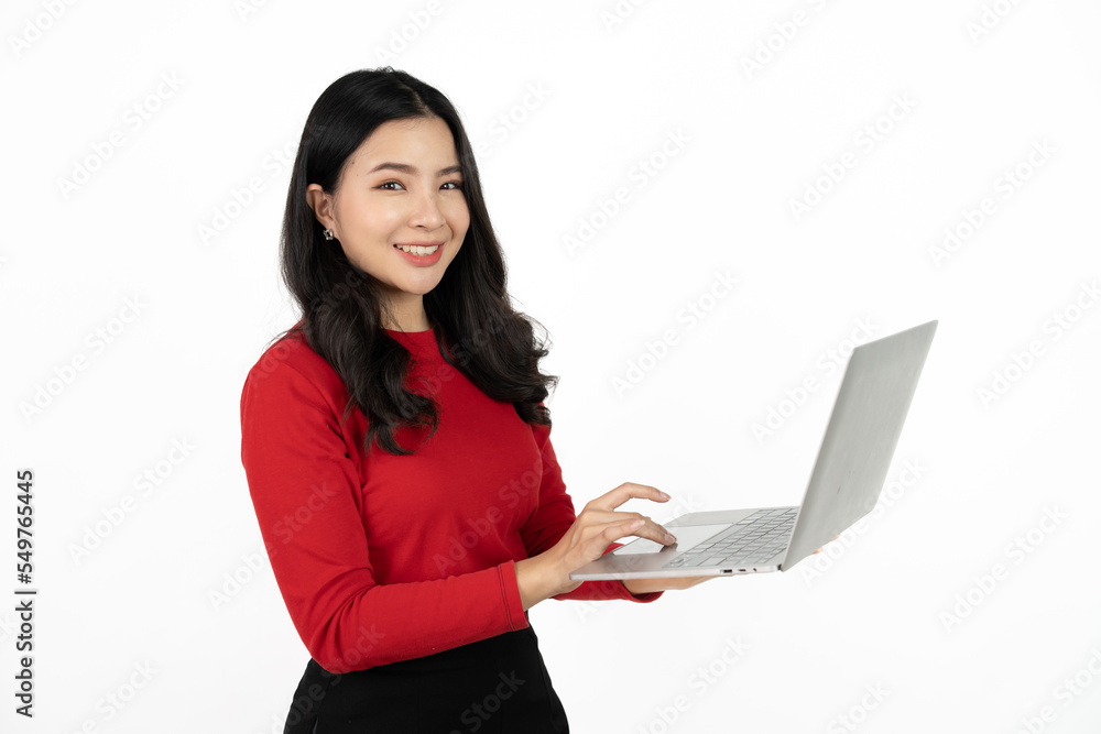 Happy asian business woman holding laptop computer and looking at the camera over white background. Happy asian business woman holding laptop computer and looking at the camera over white background.