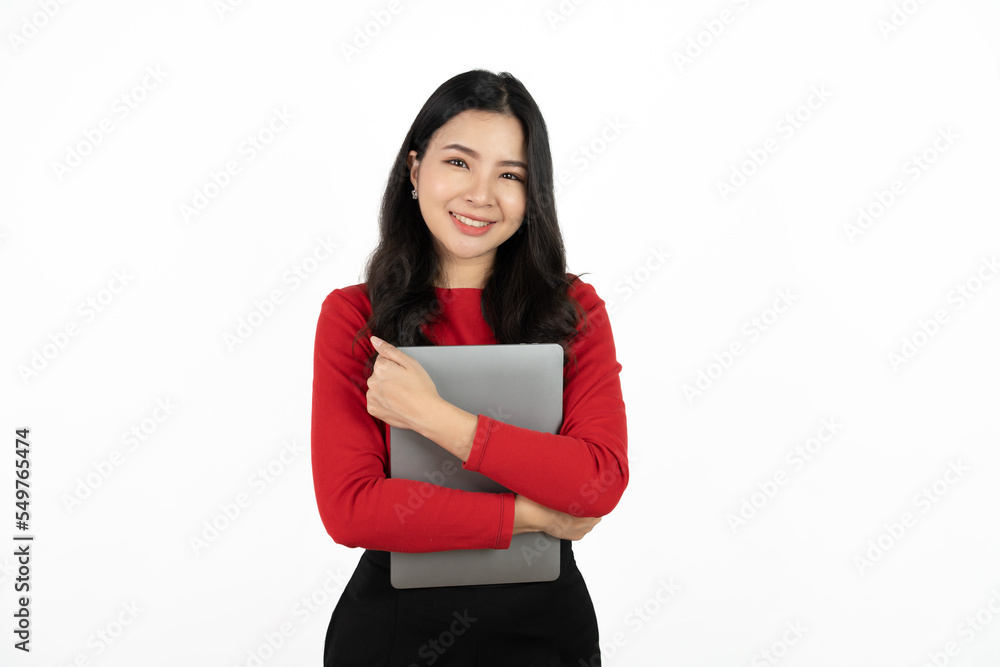 Happy asian business woman holding laptop computer and looking at the camera over white background. Happy asian business woman holding laptop computer and looking at the camera over white background.