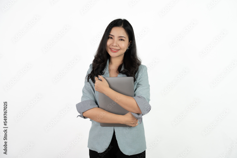 Happy asian business woman holding laptop computer and looking at the camera over white background. Happy asian business woman holding laptop computer and looking at the camera over white background.