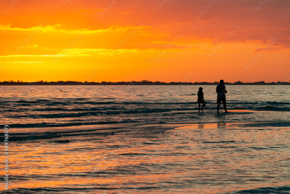 parent and child beach sunset