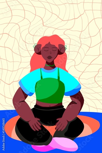 Young wavy haired woman sitting on a mat while closing her eyes to meditate