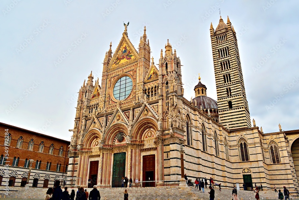external facade of cathedral of Santa Maria Assunta in the historic center of Siena in Tuscany, Italy