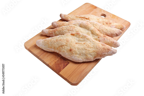 Traditional iraqi bread on a wooden tray photo