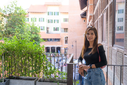 Asian female tourist with contemporary buildings background