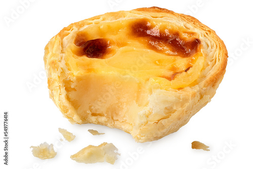 Partially eaten portuguese custard egg tart with crumbs isolated on white.