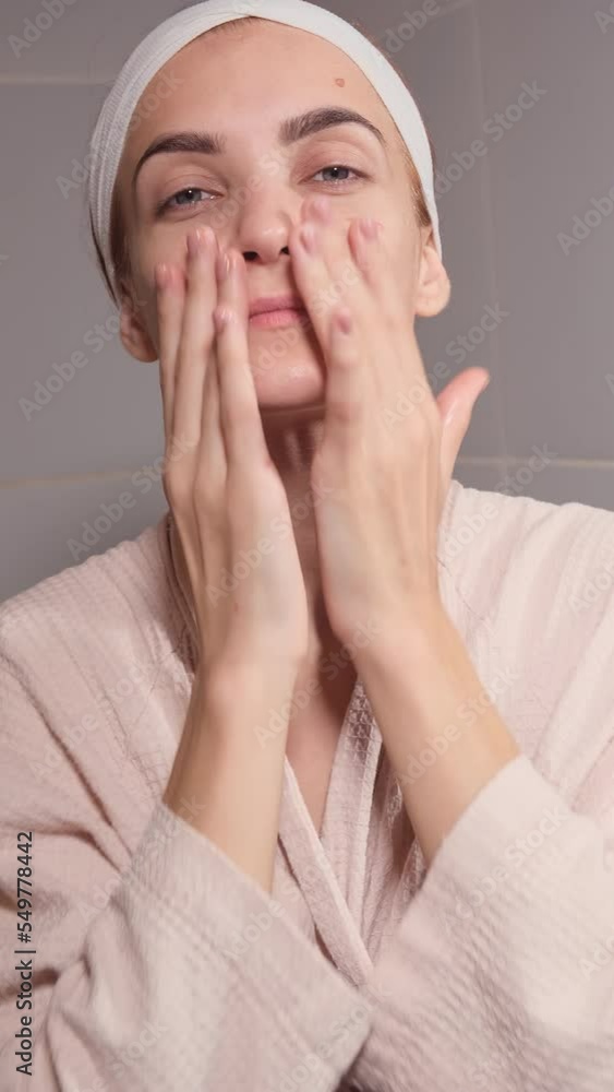Beauty Day. Woman doing her daily skincare routine in bathroom and ...