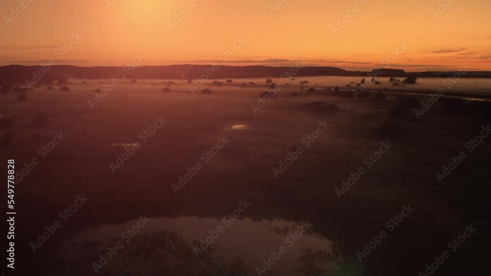 Mysterious fog over the meadow. Mystical fog at sunset Mysterious fog over the meadow. Mystical fog at sunset