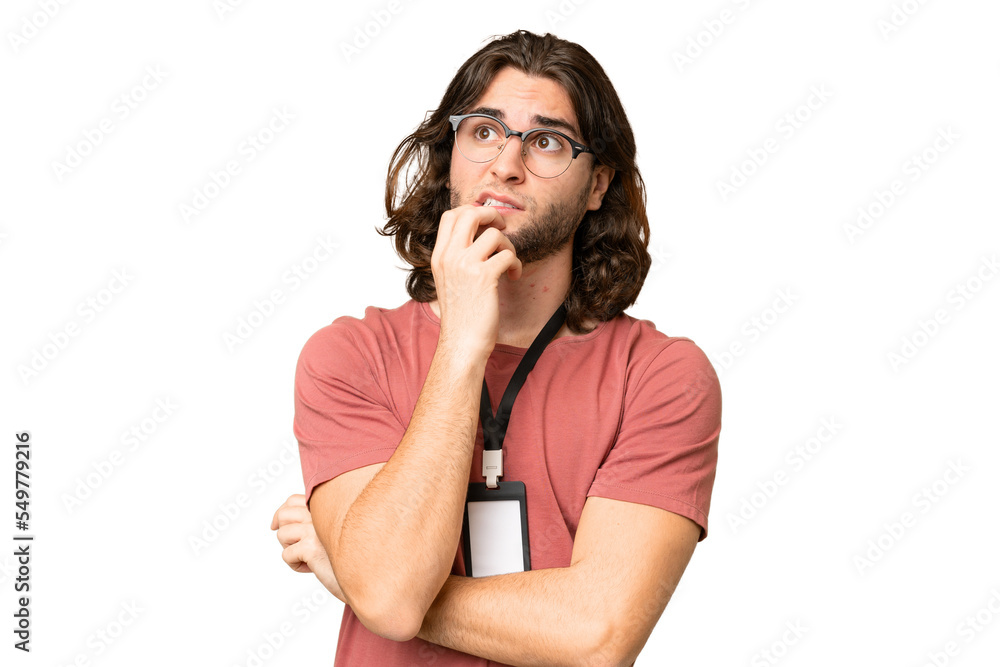 Young handsome man with ID card over isolated background having doubts and thinking Young handsome man with ID card over isolated background having doubts and thinking